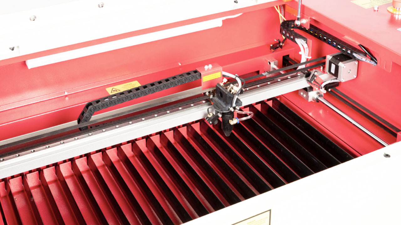 An image of a CO2 laser cutter bed