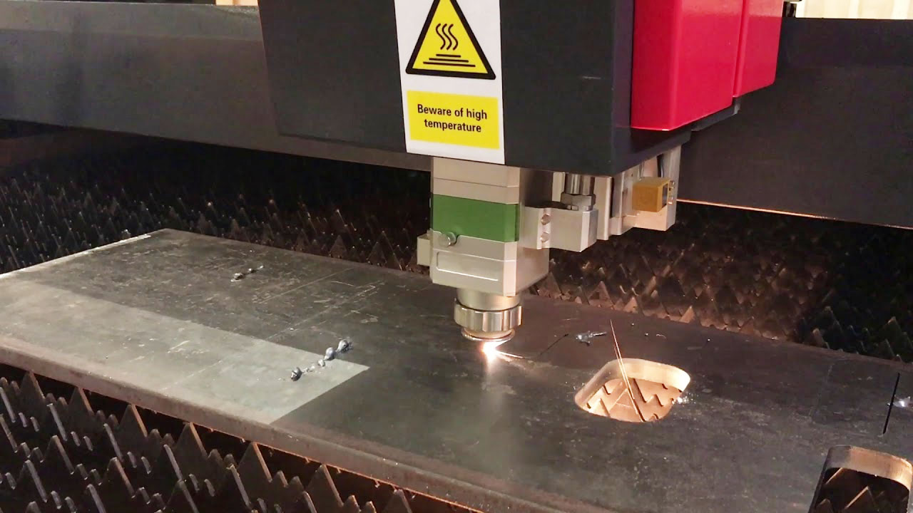 An image of a fibre laser cutter cutting think metal