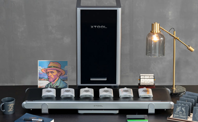 An image showing the xTool F2 Ultra in batch production using its add on conveyor