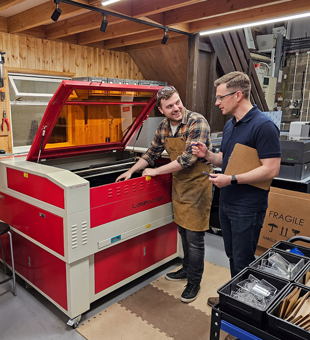 An image of a home hobbyist using his machine with a HPC Laser engineer